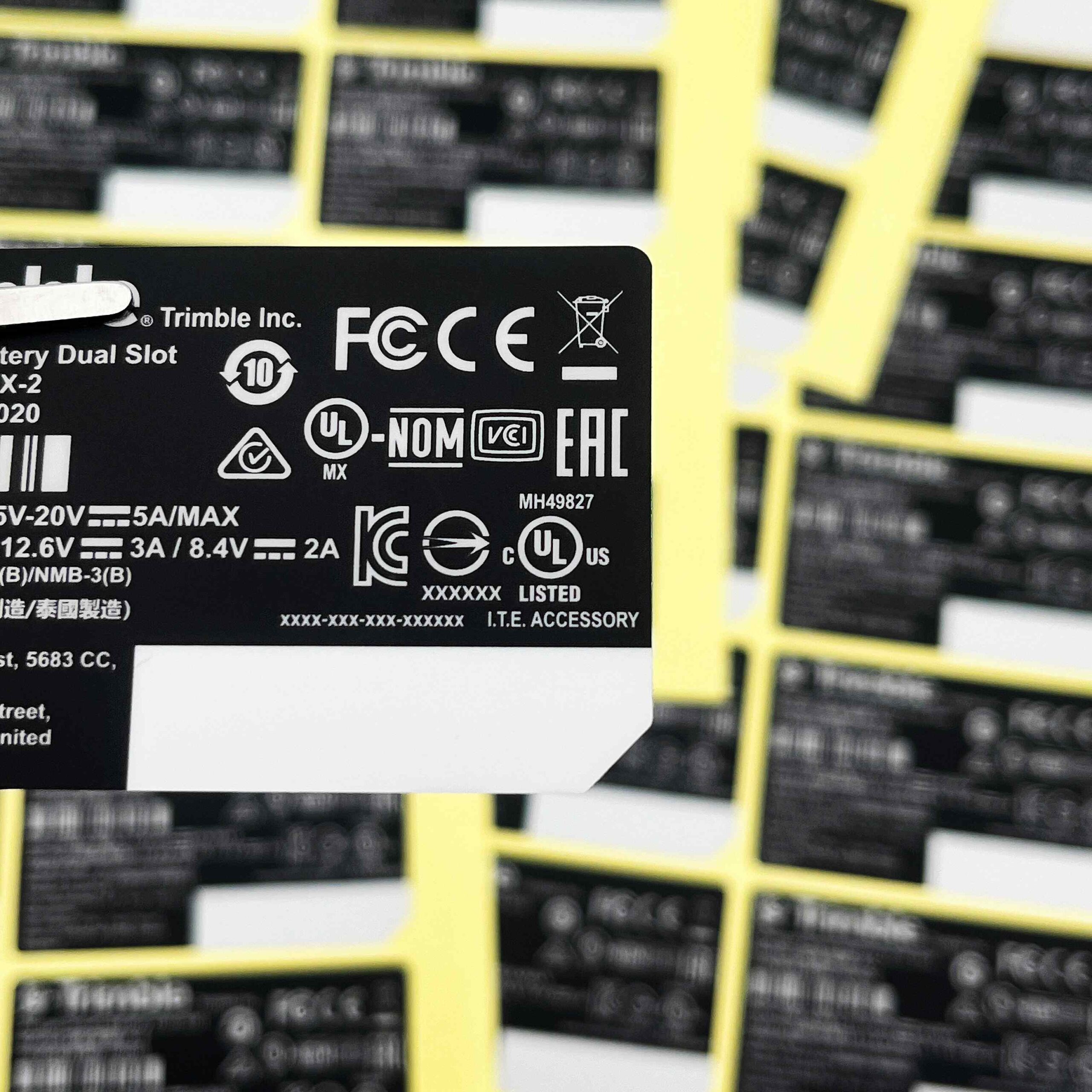 Black compliance marking label with FCC CE and regulatory symbols